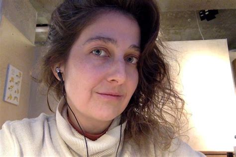a woman with headphones on taking a selfie