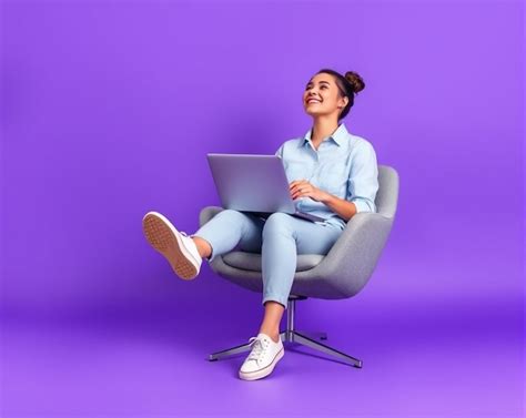 A woman sits in a chair with a laptop on her lap | Premium AI-generated ...