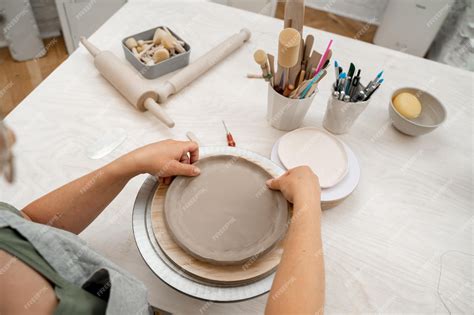 Premium Photo | Creating ceramic products from flat sheets of clay ...