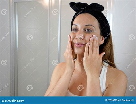 First Step, Removing Make Up with Cleansing Oil. Beautiful Young Woman ...