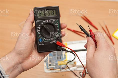 Multimeter In The Hands Of A Master Stock Photo - Download Image Now ...