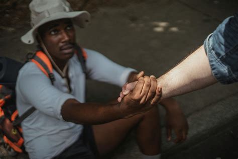 Crop multiethnic couple of gays holding hands on walkway · Free Stock Photo