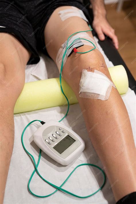 Premium Photo | Electrostimulation on the quadriceps to rehabilitate