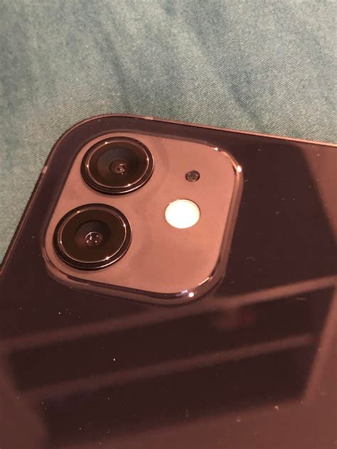 iphone 13 mini camera housing discoloration around lenses | MacRumors