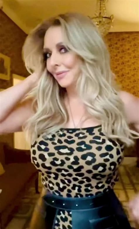 'Hottest MILF' Carol Vorderman, 62, arches back in clingy dress as fans