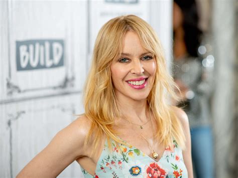 Download Kylie Minogue Glittering Performance Wallpaper | Wallpapers.com