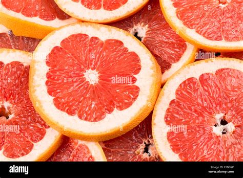 abstract red background  citrus fruit  grapefruit slices close