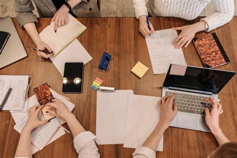 top view shot  people busy   tasks   table