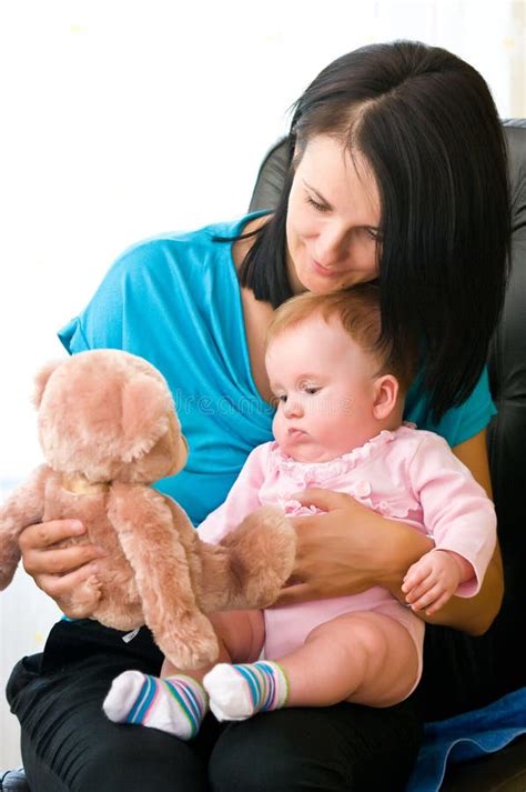 Mother and child with toy stock photo. Image of laps - 15532896