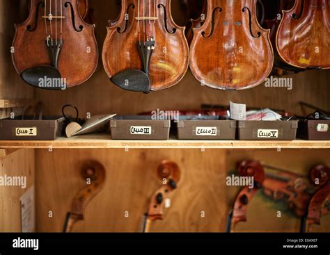 Violins and cellos in a violin maker's workshop Stock Photo - Alamy
