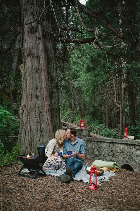 "Couple On Romantic Camping Date Making Hot Chocolate And Eating Smores