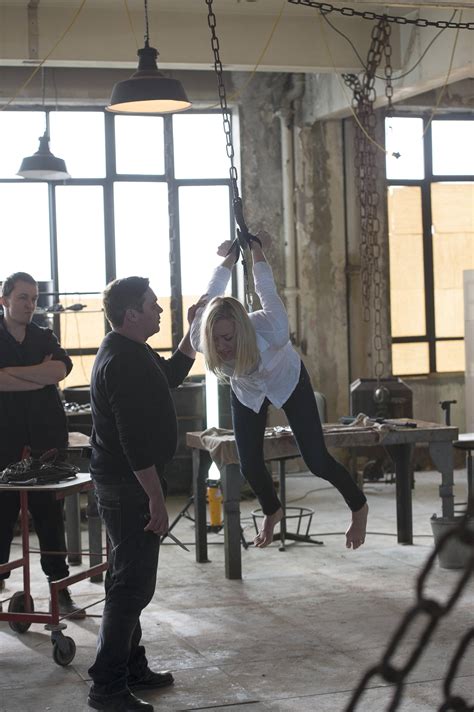 Kate Morgan (Yvonne Strahovski) chained and dangling in 24: Live