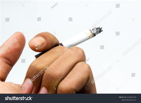 Hand Holding Cigarette On White Background Stock Photo 2212017141 ...