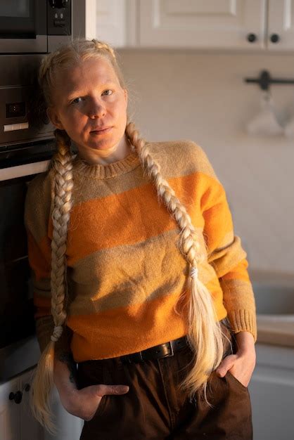 Free Photo | Albino person at home doing activities