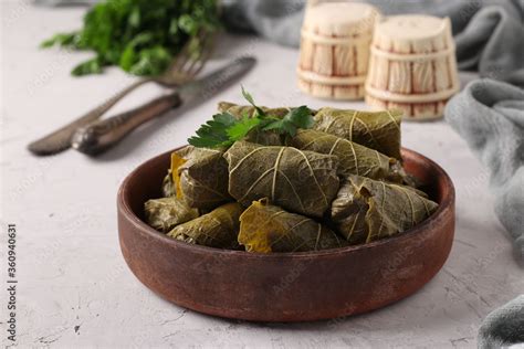 dolma stuffed grape leaves  rice  meat  light gray