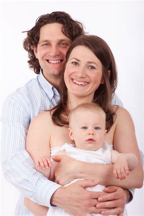 father mother  baby  stock photo public domain pictures
