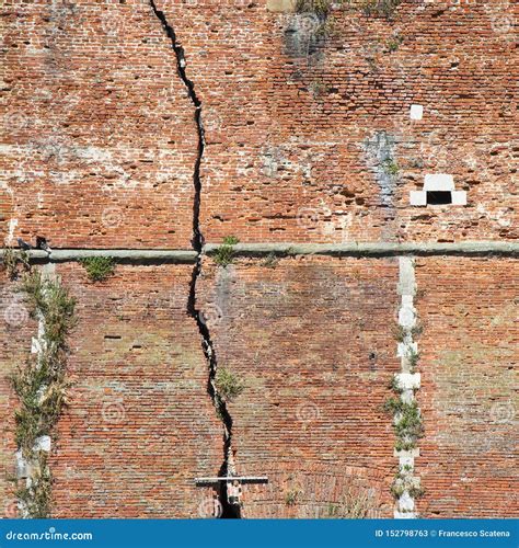 Deep Crack In A Damaged Old Stone Wall Cause Due To Subsidence Of