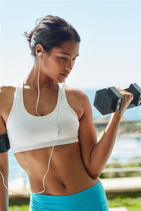 Indian Girl, Earphones and Dumbbell for Lifting in Outdoor, Bicep and ...