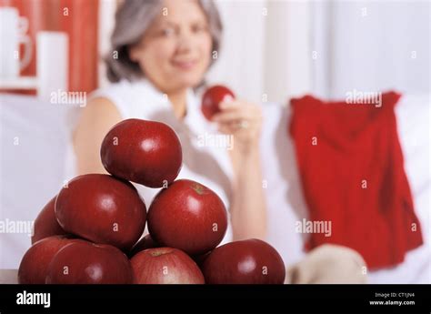ELDERLY PERSON EATING FRUIT Stock Photo - Alamy