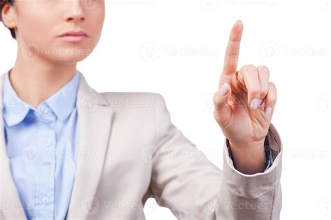 Touching new reality. Close-up of young businesswoman touching a