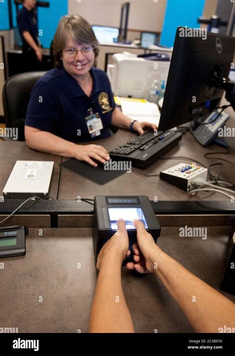 Pflugerville Texas USA, October 2012: Customer gets fingerprinted to ...