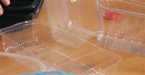 person putting plastic containers   bin  stock video footage