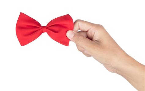 premium photo hand holding red bow isolated   white background