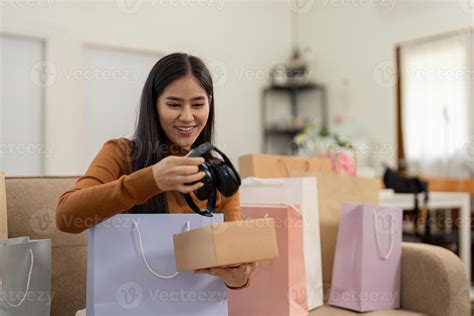 Shopping and Consumerism. Joyful woman receiving her online shopping