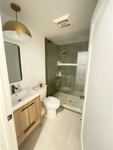 Bathroom renovation. Green vertical stacked tile, custom glass shower