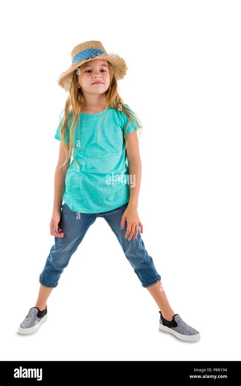 Confident little 6 year old girl in a trendy summer outfit standing ...