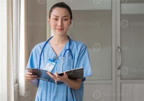 Woman doctor person wears uniform and stethoscope reading document of