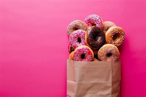 premium photo assortment  donuts   paper bag