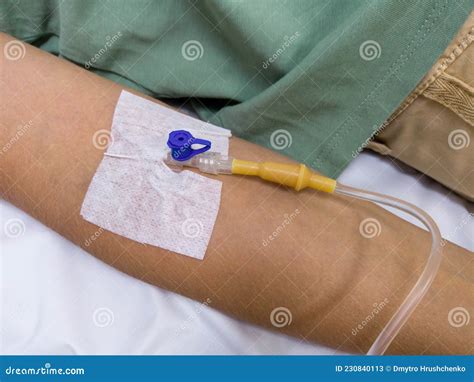 antibiotic medical dropper  needle inserted   vein   arm