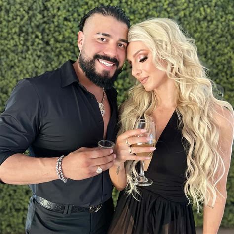 Download Andrade El Idolo And Charlotte Flair Drinking Wine Wallpaper