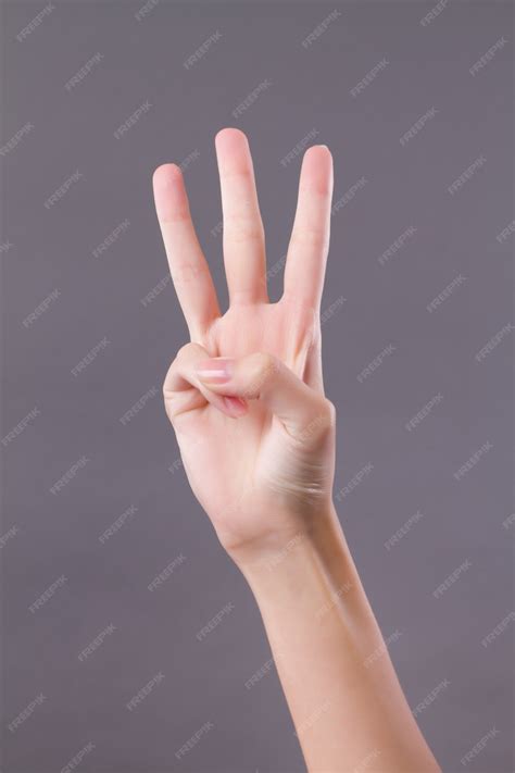 Premium Photo | Hand showing, pointing up three fingers, number three