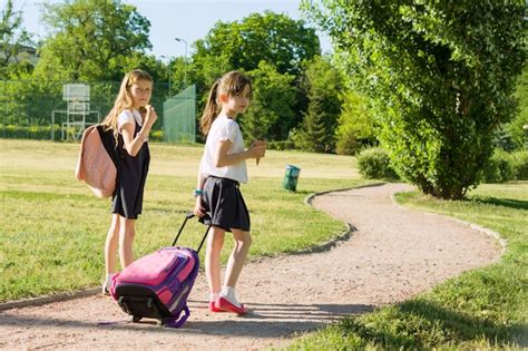 Premium Photo | Schoolgirl elementary school students walking