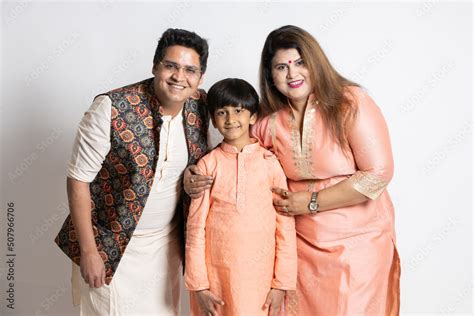 Happy young indian parents with their little son wearing ethnic festive ...