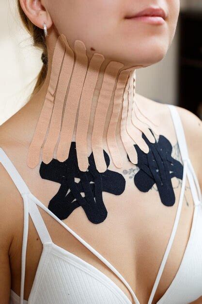 Premium Photo | Closeup of a tape on the neck of a young woman kinesiotherapy with therapeutic tapes