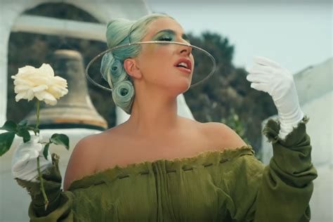 Lady Gaga wears latex, lace and metal masks in new '911' music video