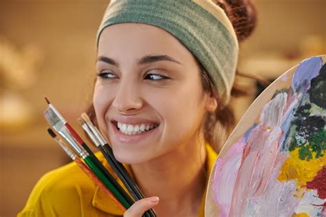 Premium Photo | Cute female artist looking happy and enjoyed