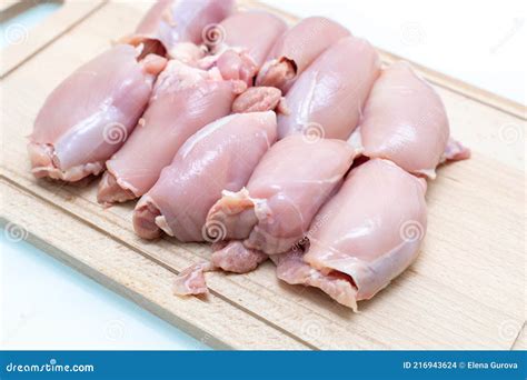 raw chicken thigh flesh   wooden cutting board stock photo image