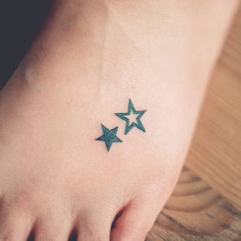 Foot tattoo of two stars by Seoeon.