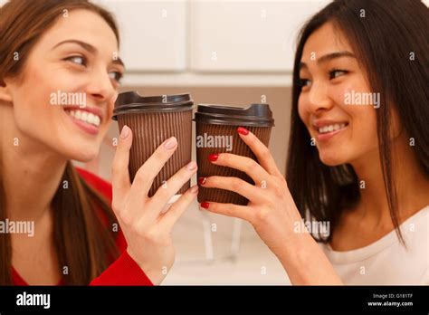 Happy students drinking Stock Photo - Alamy
