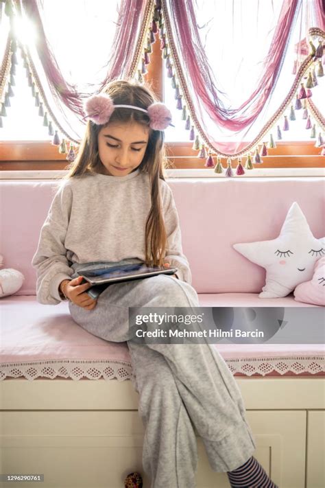 Littel Girl Using Digital Tablet At Home High-Res Stock Photo - Getty ...