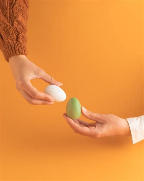 premium photo tapping  easter eggs egg knocking game egg fight