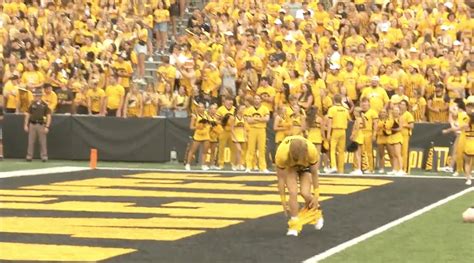 Moment Cheerleader suffers wardrobe malfunction mid college football