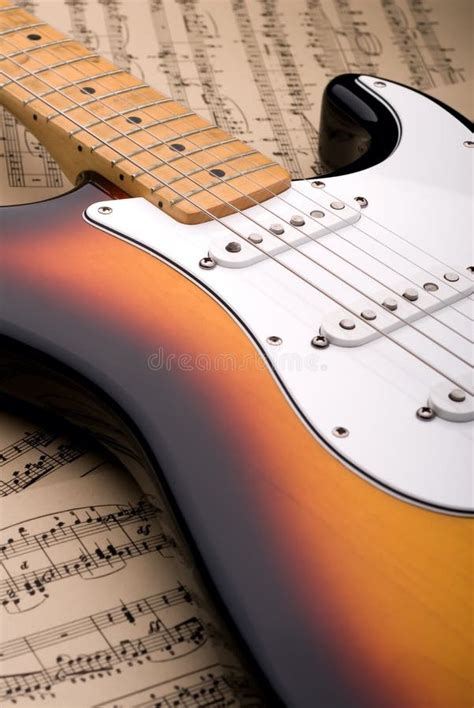 Electric Guitar and Sheet Music Stock Photo - Image of worn, font: 4510298