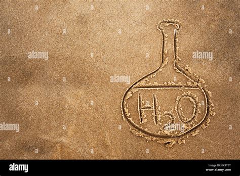 Painted flask and chemical formula of water on sand. The quality of ...
