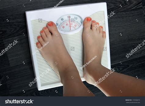 young woman weighed  scales stock photo  shutterstock