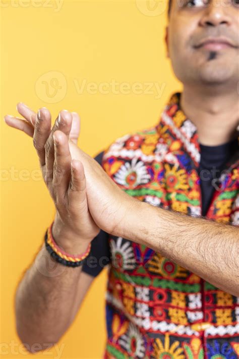 Close up shot of spectator clapping hands, praising entertainers